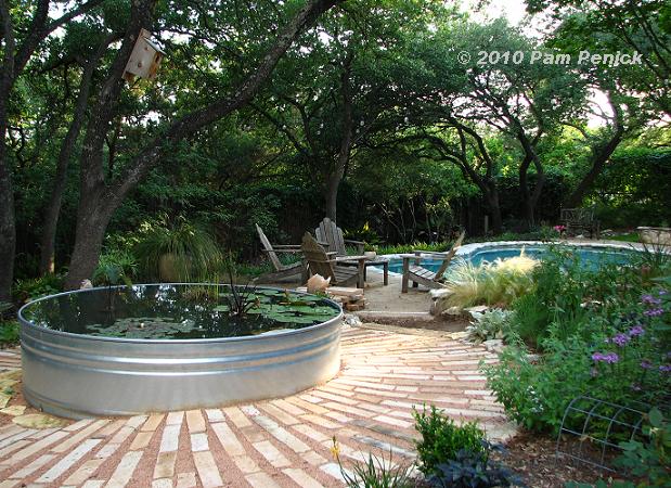 Sunburst stone path around pond