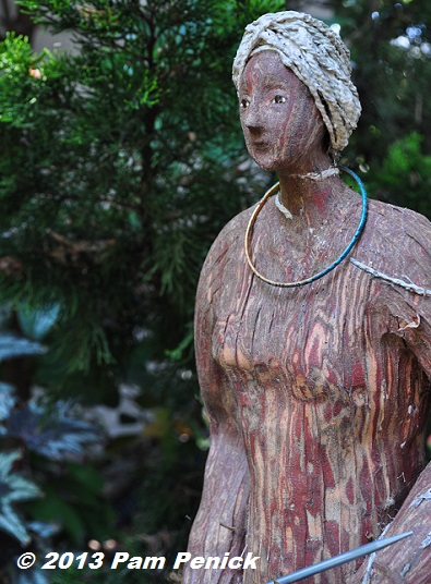 Sculpture and found objects mingle in Marcia Donahue's garden