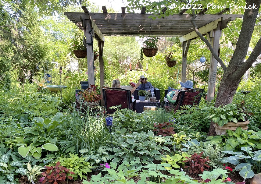 Shady oasis with folk art and inviting central patio