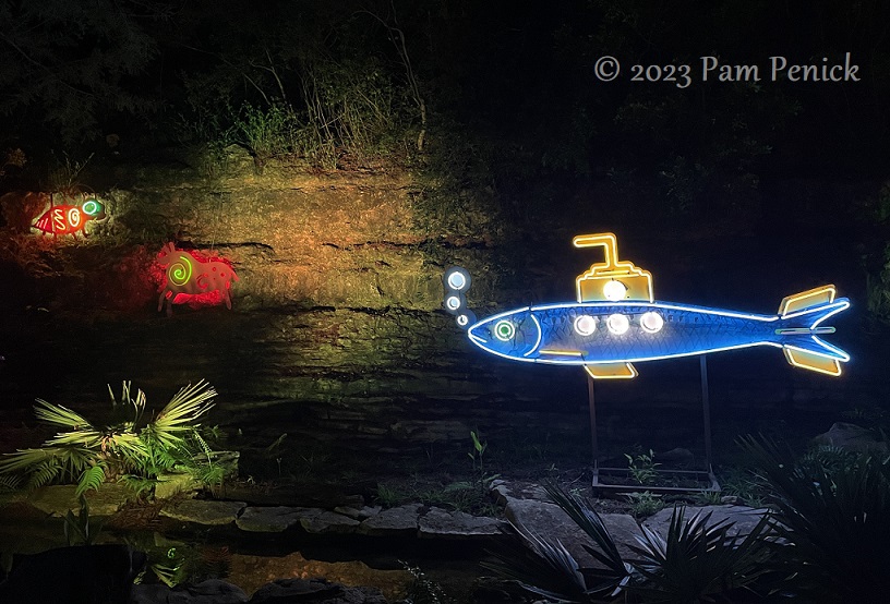 22 Fish submarine neon sculpture Zilker Backyard lights up with neon, costumes for Surreal Backyard