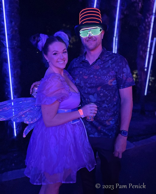 25 Couple w wings hat Zilker Backyard lights up with neon, costumes for Surreal Backyard